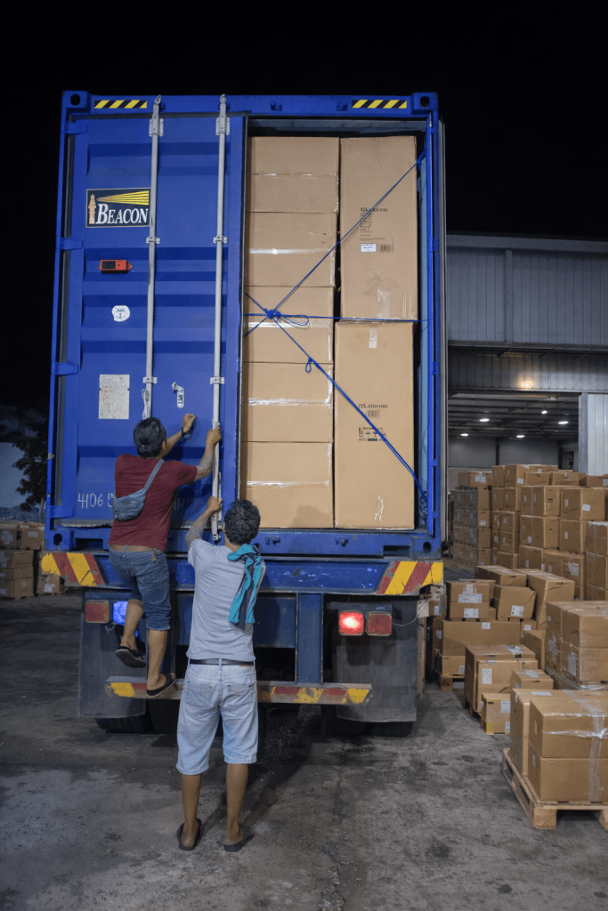 workers loading packed furniture into a shipping container for export
packed furniture products arranged inside a shipping container